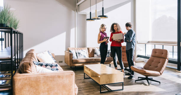 istock Three business professionals engage in a brief office meeting 2188991573