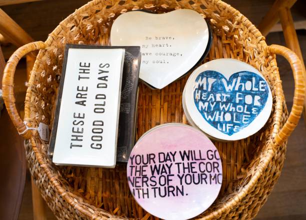 Inspirational quote plates in a wicker basket.