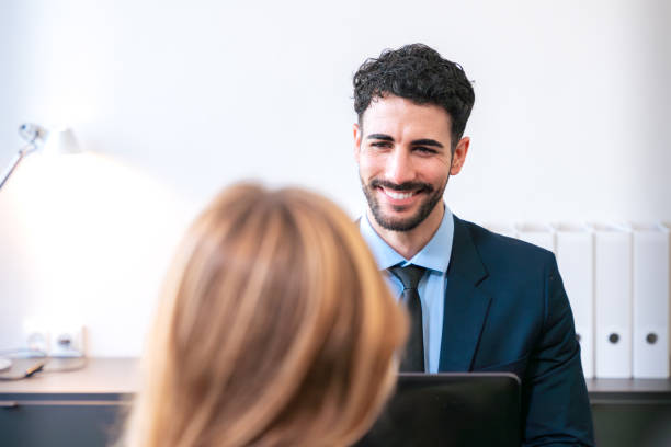 istock Professional business meeting between two colleagues in a bright office. 2188992811