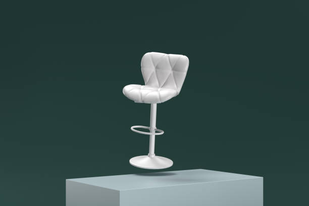 istock A white chair is sitting on a green surface 2188992934