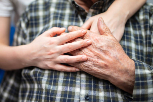 istock Comforting hand on shoulder of man 2188993223