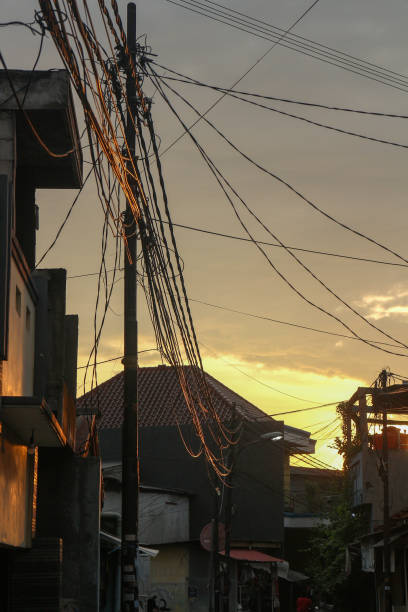 istock Urban Sunset with Tangled Power Lines 2188994595