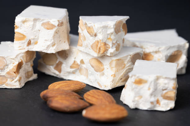 istock Hard nougat, with almonds next to it. 2188994855