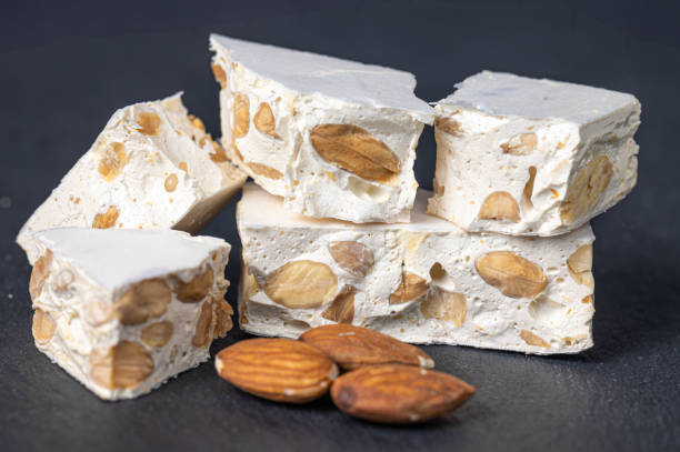 istock Hard nougat, with almonds next to it. 2188994859
