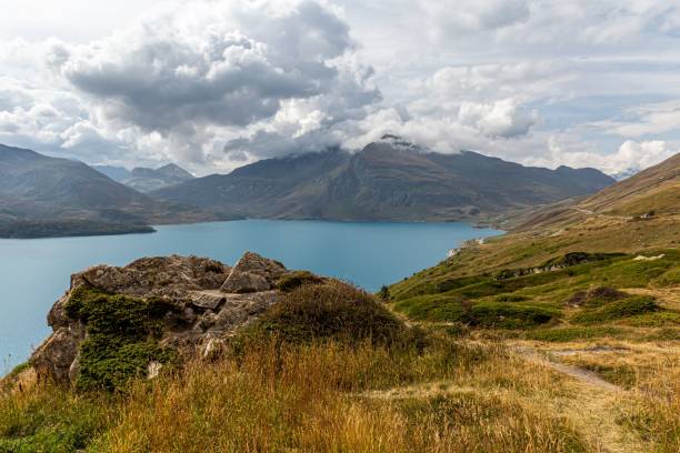 istock Mountainous landscape with blue lake and clouds. 2188998236