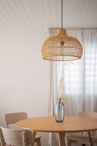 istock Sophisticated and Stylish Minimalist Dining Room Featuring a Beautiful Woven Pendant Light 2189000009