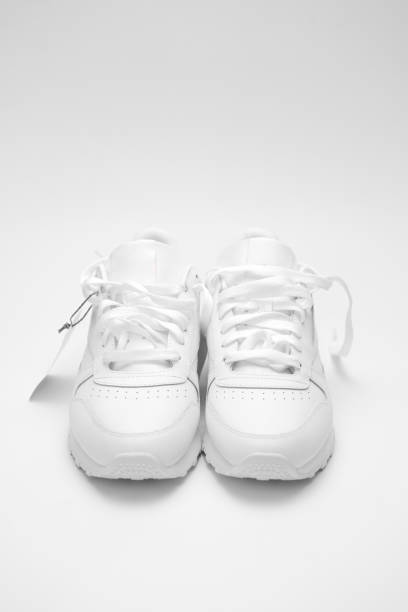 istock New white sneakers on a white background. 2189000200
