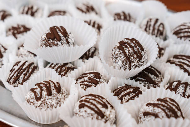 istock chocolates with coconut crumbs in paper cups. 2189000290