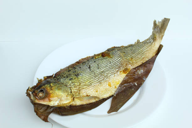istock Bandeng Presto is milk fish cooked with high pressure cooker to make fish bone become softer. Signature dish from Juwana and Semarang, Indonesia. isolated on white background 2189000366
