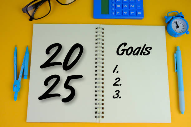 istock handwritten of 2025 BUDGET with hand element on notebook as a new year concept. 2189001076
