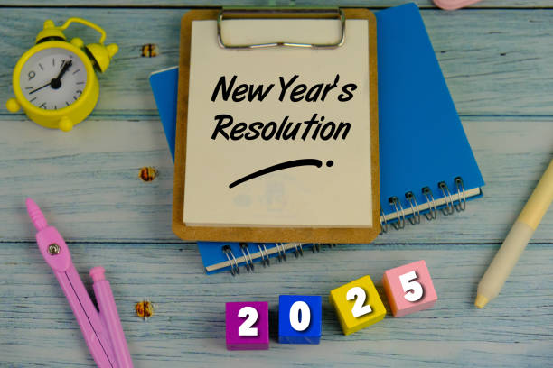 istock handwritten of new year resolution with hand element on notebook as a new year concept. 2189001282