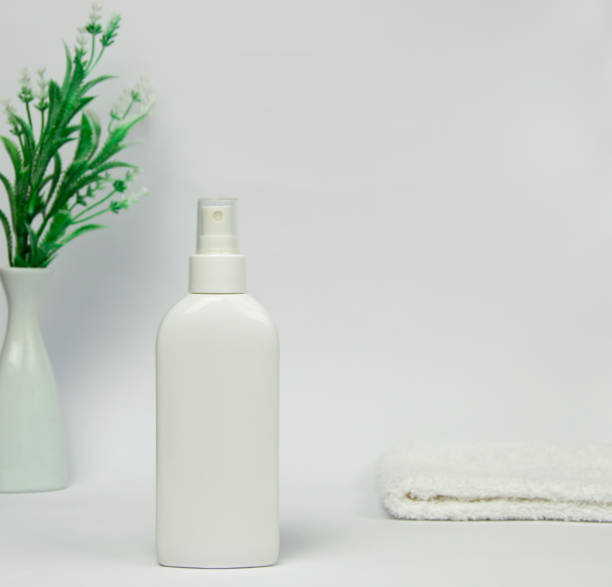 istock White unbranded dispenser or spray bottle isolated on white background. Cosmetic packaging mockup with copy space. 2189002019