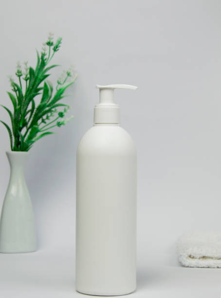 istock White unbranded dispenser or spray bottle isolated on white background. Cosmetic packaging mockup with copy space. 2189002022