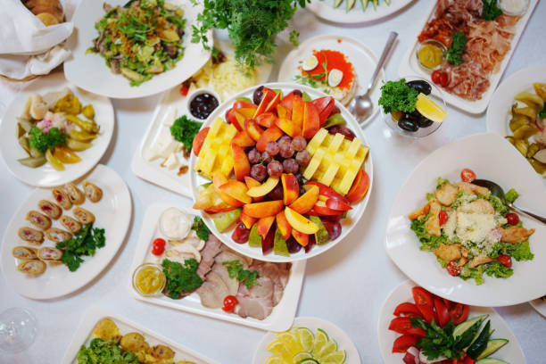 Summer fruit and cheese platter. A vibrant assortment of fresh fruits and cheese arranged beautifully, perfect for a summer gathering or outdoor celebration.