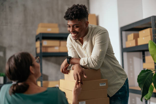 istock Two coworkers managing warehouse inventory 2189003672