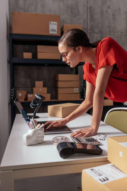Woman working in a small business warehouse