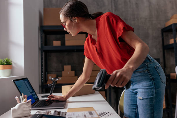 istock Focused female preparing an online order 2189003750
