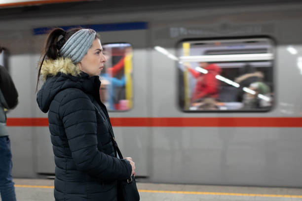 istock Woman waiting at the subway for her train to arrive. 2189004578