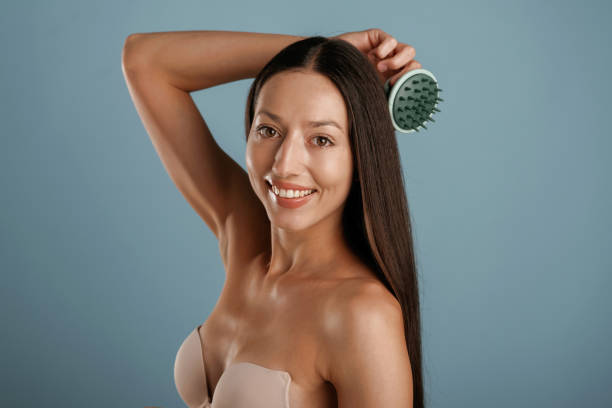 istock Young woman is in the studio against background 2189005263
