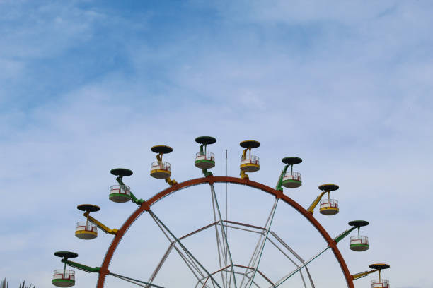 istock Ferris wheel with cloudy blue sky background 2189007588