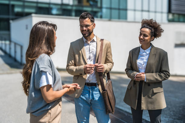 istock Group of modern successful business people innovative technology experts standing out of office building, discussing ideas and innovations. Leaders in global marketing strategy professional occupation 2189007768