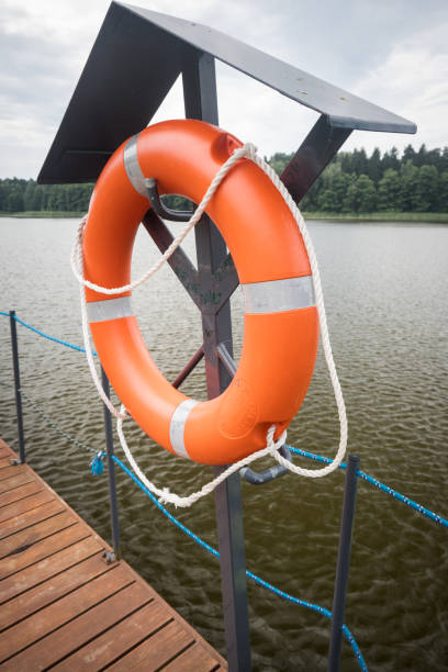 A pier with a lifebuoy storage area, water rescue.