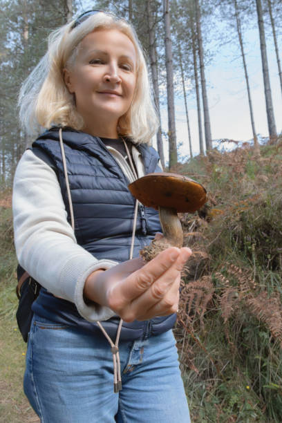 istock Woman shows a mushroom 2189011529