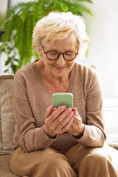 istock Happy senior woman using smart phone 2189011725