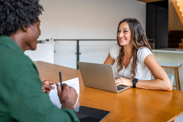 istock Two Professionals Engaging in a Positive Office Meeting Discussion 2189011745