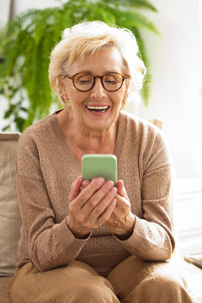 istock Happy senior woman using smart phone 2189011769