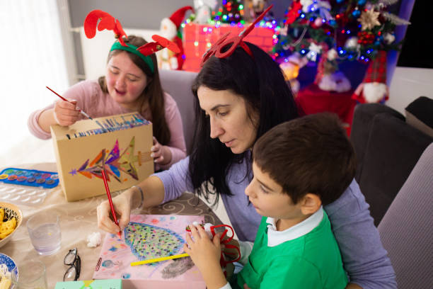 istock Autistic boy joining his family in a creative workshop 2189012506