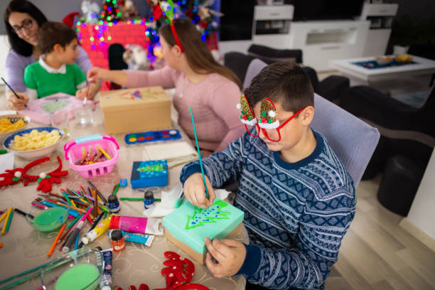 istock Happy family crafting together on Christmas 2189012777