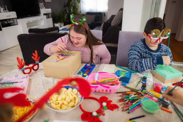 istock Neurodiverse family creating Christmas ornaments together 2189013337