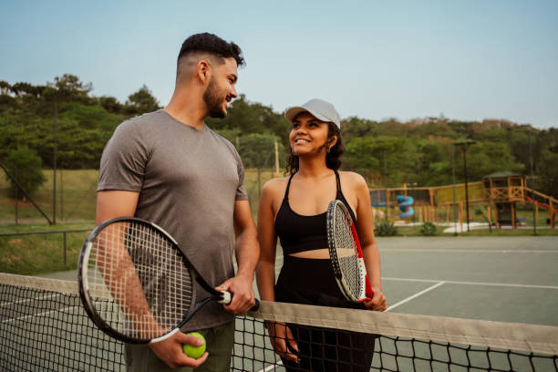 istock Couple playing tennis together 2189013570