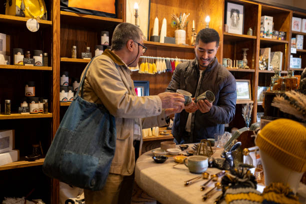 istock Father Shopping Local with his Son 2189015212
