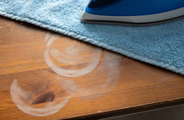istock Concept of remove ugly white round heat stains from home kitchen table. 2189015292