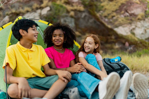 istock Child friends talking and camping outdoors 2189015622