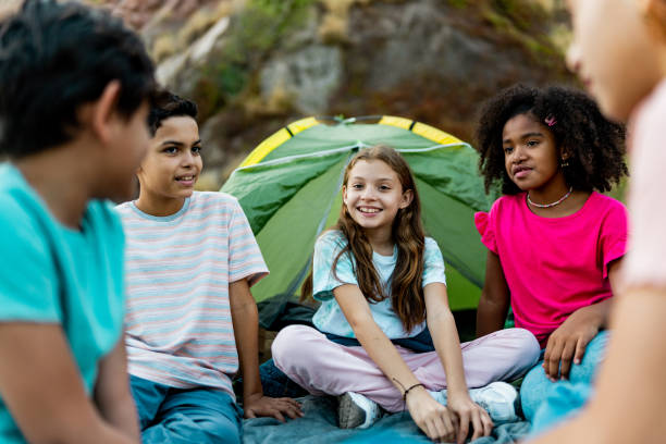 istock Child friends talking and camping outdoors 2189015675