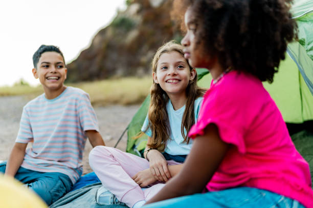 istock Child friends talking and camping outdoors 2189015677