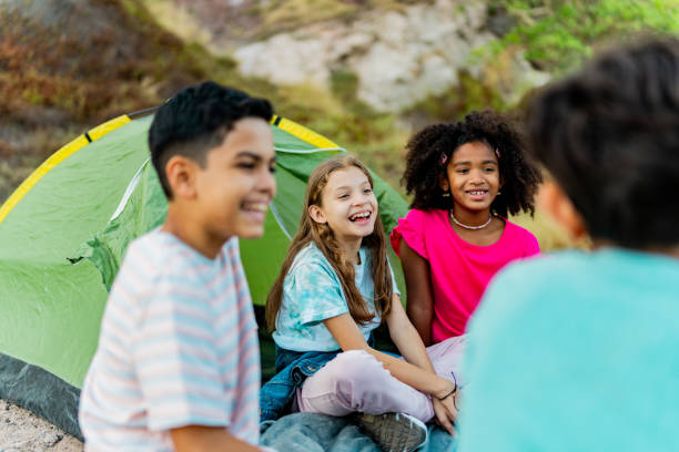 istock Child friends talking and camping outdoors 2189015694
