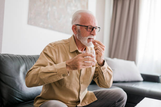 istock Senior man taking daily dosage of medicines 2189015758