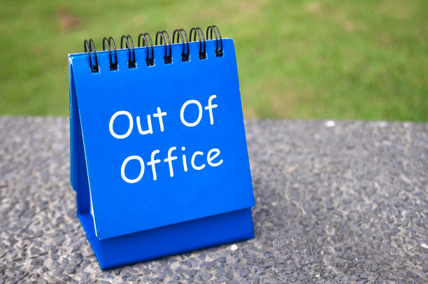 istock Side view of Out Of Office text on blue notepad. Off work concept 2189015849