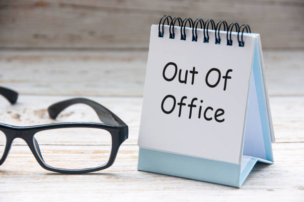 istock Side view of Out Of Office text on white notepad. Off work concept 2189015856