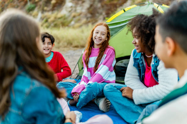 istock Child friends talking and camping outdoors 2189015992