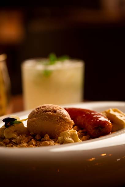 istock Gourmet dessert with ice cream and caramelized banana. 2189016159