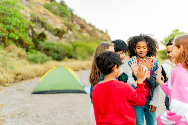 istock Child friends celebrating with high-five during summer camp 2189016710