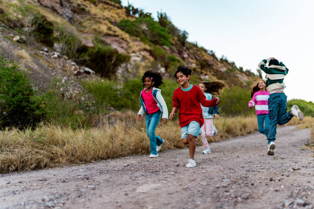 istock Child friends running during summer camp outdoors 2189016719