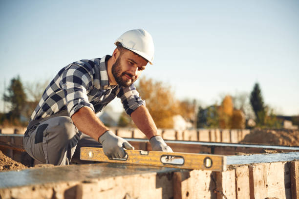 istock Tool for measuring leveling of surface. Worker is on the construction site at daytime 2189017502