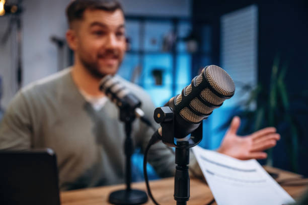 istock Man with microphone in the studio, conception of podcast 2189018733