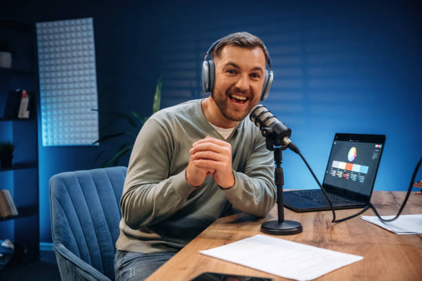 istock Morning radio. Man with microphone in the studio, conception of podcast 2189019287